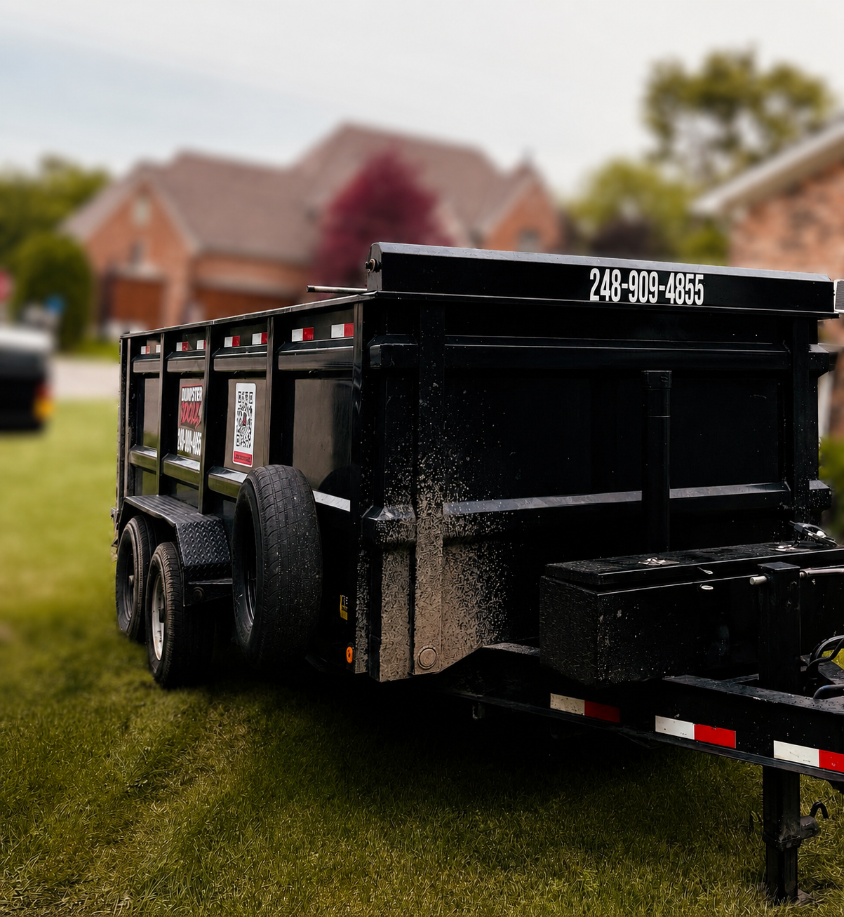 15-yard lawn-safe rubber wheel dumpster rental at a home renovation project in Wolverine Lake, Michigan