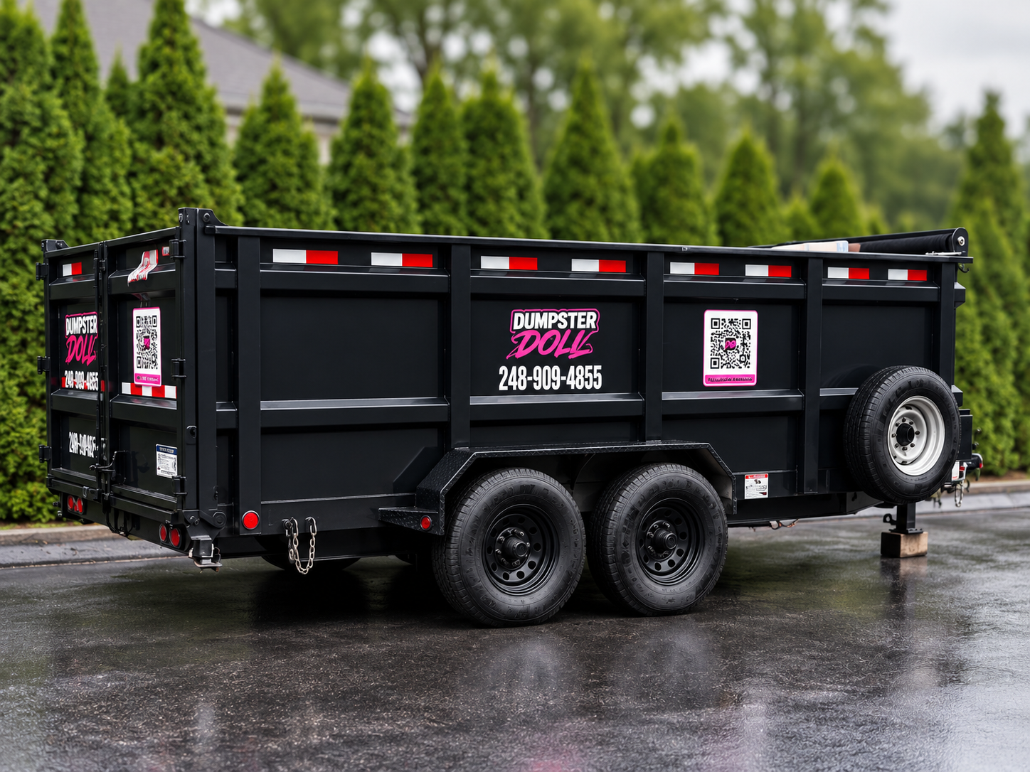 Dumpster Doll rubber wheel dumpster trailer parked in Bloomfield Hills