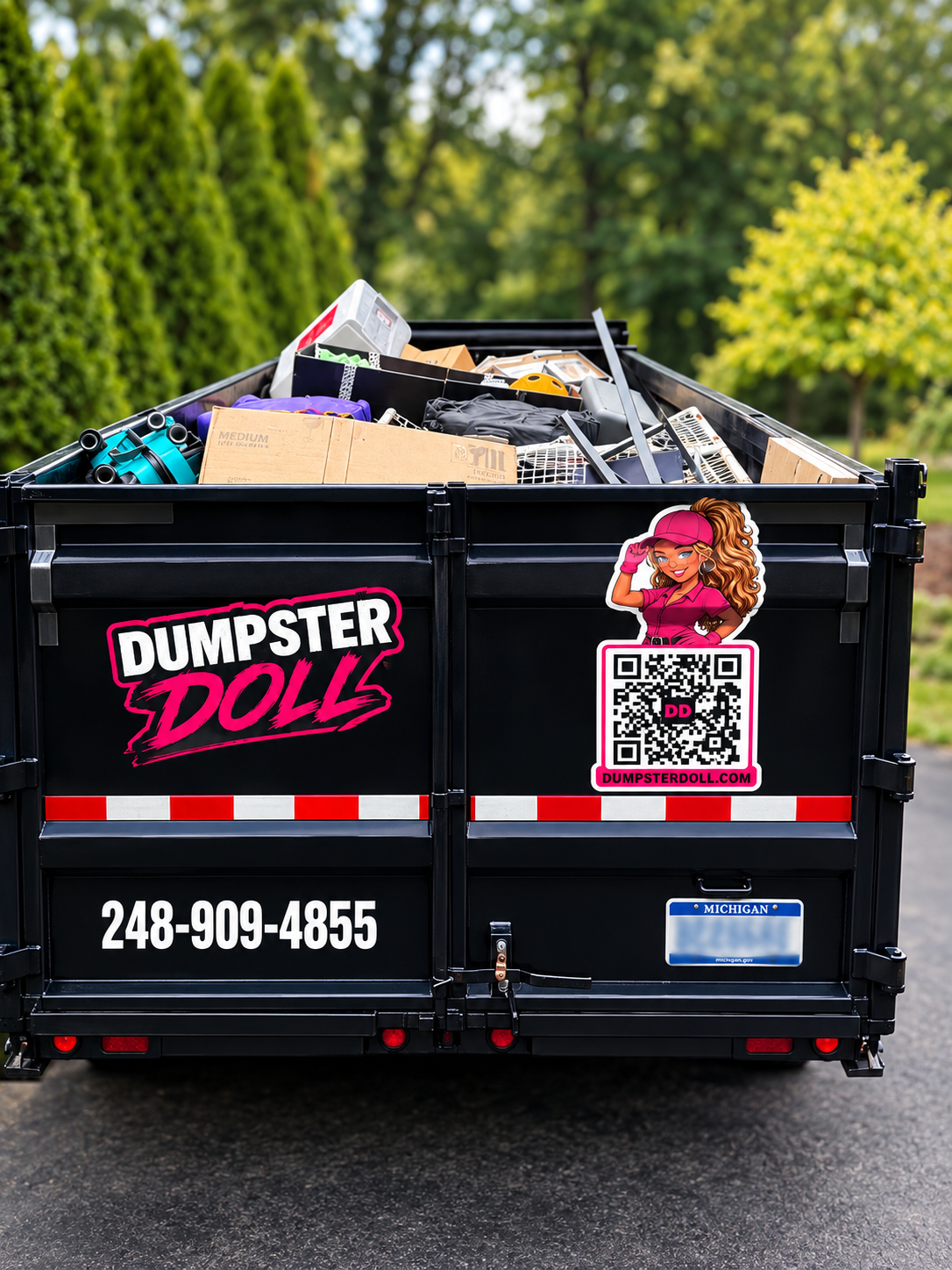 Loaded Dumpster Doll rubber wheel dumpster in a Bloomfield Hills driveway after a whole-home declutter